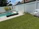 Backyard with a pool and white chairs at 783 30Th N Ave, St Petersburg, FL 33704