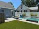 Wide backyard with pool, lawn, and perimeter fence at 783 30Th N Ave, St Petersburg, FL 33704