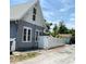 Exterior view of blue home with a white fence at 783 30Th N Ave, St Petersburg, FL 33704