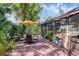 Scenic backyard offering a brick patio, mature landscaping, and outdoor seating, perfect for relaxation and entertaining at 7915 4Th W Ave # 7915, Bradenton, FL 34209