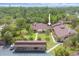 This exterior view shows the well-maintained property with beautiful landscaping and convenient parking at 7915 4Th W Ave # 7915, Bradenton, FL 34209