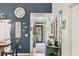 Stylish hallway featuring wood floors, charming decor, and a view of the front entrance at 7915 4Th W Ave # 7915, Bradenton, FL 34209