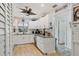 Bright kitchen featuring white cabinets, granite countertops, and stainless steel appliances at 7915 4Th W Ave # 7915, Bradenton, FL 34209