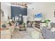 Open-concept living area with vaulted ceiling, dining space, and entertainment center at 7915 4Th W Ave # 7915, Bradenton, FL 34209