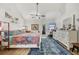 Spacious main bedroom featuring wood floors, vaulted ceilings, and a private door to the outside at 7915 4Th W Ave # 7915, Bradenton, FL 34209