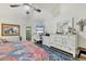 Large main bedroom featuring wood floors, vaulted ceilings, and access to the outside at 7915 4Th W Ave # 7915, Bradenton, FL 34209