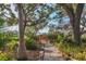 A nature trail with a wooden bridge surrounded by lush vegetation leads to waterfront views at 7915 4Th W Ave # 7915, Bradenton, FL 34209