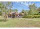 Exterior shot featuring covered parking with multiple vehicles and lush green surroundings on a sunny day at 7915 4Th W Ave # 7915, Bradenton, FL 34209