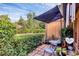 Charming outdoor patio with stone pavers, comfortable seating, and a beautifully landscaped garden setting at 7915 4Th W Ave # 7915, Bradenton, FL 34209