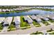Beautiful aerial view of lakeside homes featuring manicured lawns and paver driveways at 8148 Sternway Rd, Sarasota, FL 34240