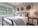 This bedroom offers a relaxing ambiance with neutral colors, side tables, and decor that compliments the design at 8148 Sternway Rd, Sarasota, FL 34240