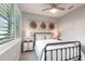 This bedroom offers a relaxing ambiance with neutral colors, side tables, and decor that compliments the design at 8148 Sternway Rd, Sarasota, FL 34240