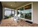 Cozy patio with outdoor seating, a ceiling fan, and sliding glass doors at 8148 Sternway Rd, Sarasota, FL 34240