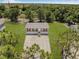 Aerial view of a single-story home on a large lot surrounded by trees at 8426 Sweden Blvd, Punta Gorda, FL 33982