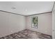 Bright bedroom featuring wood-look flooring and a window providing ample natural light at 8426 Sweden Blvd, Punta Gorda, FL 33982