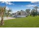 Charming home with a gravel driveway, well maintained lawn, and freshly painted siding at 8426 Sweden Blvd, Punta Gorda, FL 33982