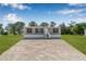 Charming home with a gravel driveway, well maintained lawn, and freshly painted siding at 8426 Sweden Blvd, Punta Gorda, FL 33982
