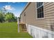 Side angle exterior of home with a lush lawn at 8426 Sweden Blvd, Punta Gorda, FL 33982