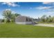 Charming home with a gravel driveway, well maintained lawn, and freshly painted siding at 8426 Sweden Blvd, Punta Gorda, FL 33982