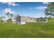 Exterior of home with a lush lawn at 8426 Sweden Blvd, Punta Gorda, FL 33982