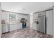 Modern kitchen featuring stainless appliances, white cabinets and eat-in dining at 8426 Sweden Blvd, Punta Gorda, FL 33982