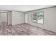 Well-lit living room with sleek floors, neutral walls, and bright windows at 8426 Sweden Blvd, Punta Gorda, FL 33982