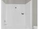 Shower-tub combo with white interior and black 