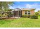 The home features a screened in patio, lawn, and landscaping, creating a perfect outdoor retreat at 8437 Nandina Dr, Sarasota, FL 34240