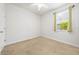 Bright bedroom with a ceiling fan and a large window providing ample natural light at 8437 Nandina Dr, Sarasota, FL 34240