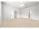 Empty carpeted bedroom with multiple entryways and neutral walls at 8437 Nandina Dr, Sarasota, FL 34240