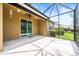 A screened patio features a ceiling fan and sliding glass doors that seamlessly blend indoor and outdoor living at 8437 Nandina Dr, Sarasota, FL 34240