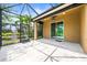 The covered patio offers a relaxing space, with views of the lush landscaping and tropical plants at 8437 Nandina Dr, Sarasota, FL 34240