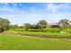 Home with a backyard overlooking a serene pond, enhancing privacy and providing peaceful views at 8437 Nandina Dr, Sarasota, FL 34240