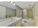 Well-maintained bathroom features a tub and shower combination with a sliding glass door at 96 Boundary Blvd # 127, Rotonda West, FL 33947