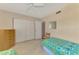 Bedroom includes a large closet and light wood flooring at 96 Boundary Blvd # 127, Rotonda West, FL 33947