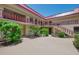 Charming courtyard view with well-maintained landscaping and multi-story buildings at 96 Boundary Blvd # 127, Rotonda West, FL 33947