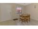Cozy dining area with a round table and four chairs at 96 Boundary Blvd # 127, Rotonda West, FL 33947