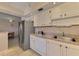 This cozy kitchen features stainless steel appliances and tile flooring at 96 Boundary Blvd # 127, Rotonda West, FL 33947