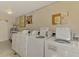 Convenient on-site laundry room with multiple washing machines for residents at 96 Boundary Blvd # 127, Rotonda West, FL 33947