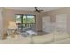 Cozy living room with a sofa, chairs, and sliding glass doors to balcony at 96 Boundary Blvd # 127, Rotonda West, FL 33947