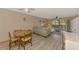 Inviting living room featuring a comfortable sofa and light wood-look floors at 96 Boundary Blvd # 127, Rotonda West, FL 33947