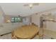 Open living space featuring living area, kitchen, and dining table at 96 Boundary Blvd # 127, Rotonda West, FL 33947