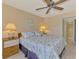 Comfortable main bedroom features two end tables and bright natural lighting at 96 Boundary Blvd # 127, Rotonda West, FL 33947