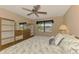 The main bedroom showcases a ceiling fan, natural lighting, and closet space at 96 Boundary Blvd # 127, Rotonda West, FL 33947