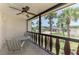 Charming screened patio with table and chairs overlooking the tropical landscaping at 96 Boundary Blvd # 127, Rotonda West, FL 33947