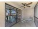Relaxing patio area with seating, ceiling fan, and sliding door access to the living area at 96 Boundary Blvd # 127, Rotonda West, FL 33947