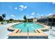 Beautifully maintained outdoor swimming pool, with ladders and a shallow end, set for relaxation at 96 Boundary Blvd # 127, Rotonda West, FL 33947