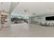 Bright recreation room features tile floors, ceiling fans, and access to an outdoor patio space for comfortable enjoyment at 96 Boundary Blvd # 127, Rotonda West, FL 33947