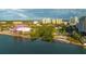 Aerial view showcases buildings by bay, with trees, park, and scenic waterfront at 988 Blvd Of The Arts # 1016, Sarasota, FL 34236