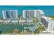 Stunning aerial view of waterfront condos with marina, pool, and beautiful ocean views at 988 Blvd Of The Arts # 1016, Sarasota, FL 34236